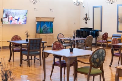 Empty common area with tables and chairs