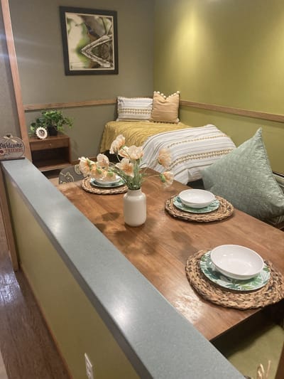 Cozy private resident room with decor and dining setup