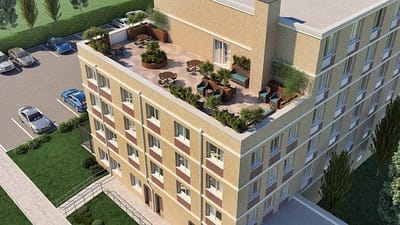 Aerial view of the Holliswood Center building and outdoor space