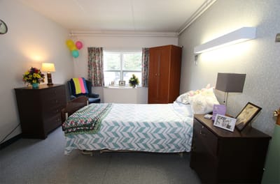 Cozy resident room with decorations and a bed
