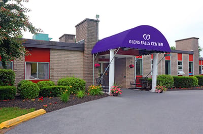 Exterior view of Glens Falls Center with purple awning