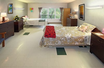Interior view of a shared resident room with two beds
