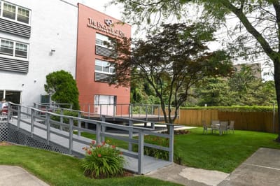 Exterior view of The Enclave at Rye with outdoor seating
