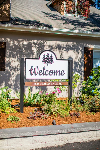 Welcome sign in front of a senior living facility