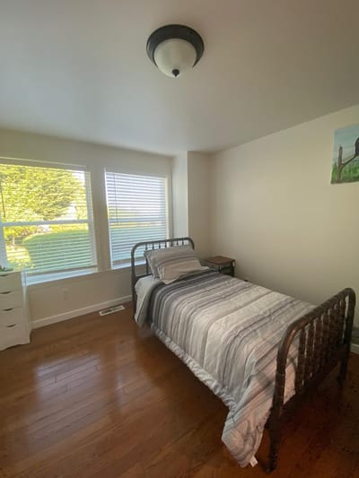 Private resident room with a bed and natural light