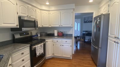 Bright kitchen with modern appliances and wooden floors