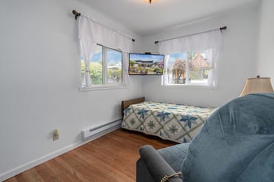 Cozy private room with a bed and TV