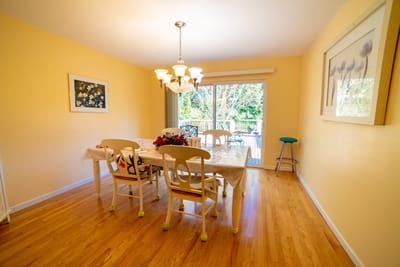 Dining area with a table set and natural light
