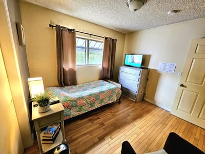 Cozy private room with bed and TV