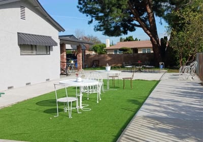 Outdoor seating area with tables and chairs
