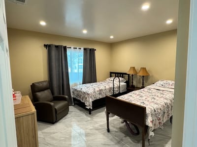 Private resident room with two beds and furniture