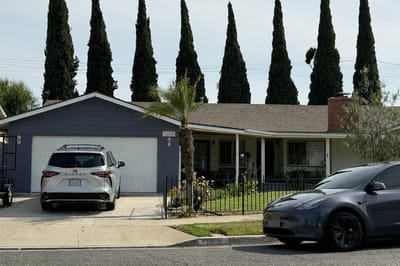 Exterior view of a house with tall trees