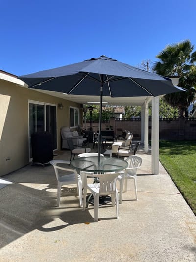 Outdoor patio with seating and umbrella