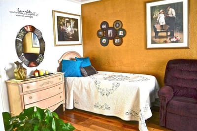Cozy bedroom setup with decorative accents and personal touches