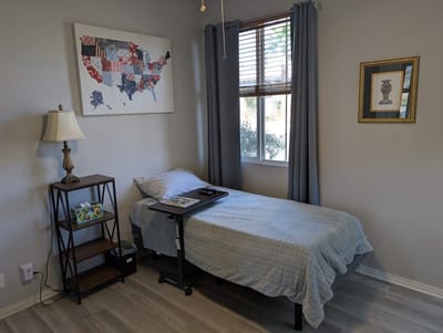 A cozy resident room with a bed and decor