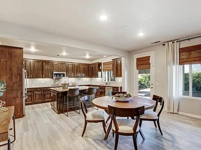Bright, spacious common area with kitchen and dining table