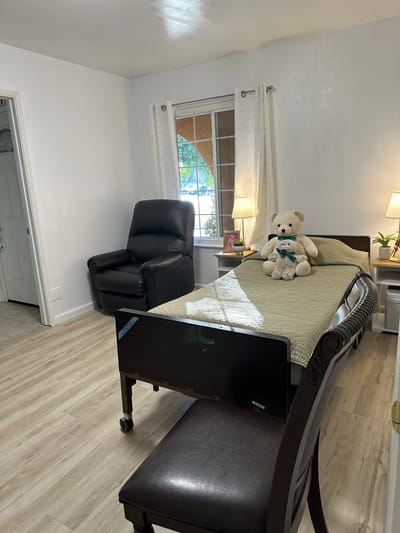 Cozy resident room with a bed and teddy bear