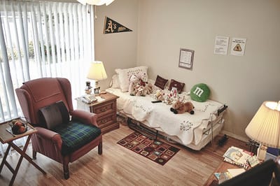 Cozy private resident room with plush toys and a bed