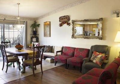 Cozy common area with colorful seating and a dining table