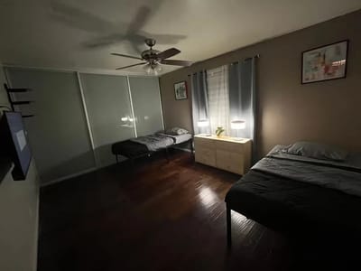Cozy twin bedroom with natural light and simple decor