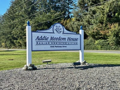 Sign of Addie Meedom House in a landscaped area
