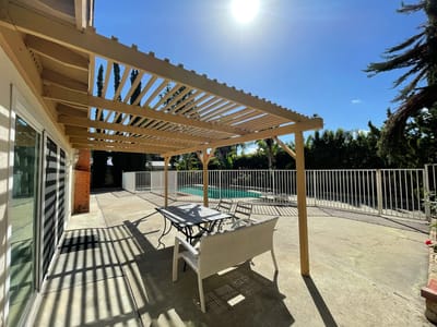 Outdoor seating area with pool view