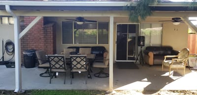 Outdoor seating area with tables and chairs