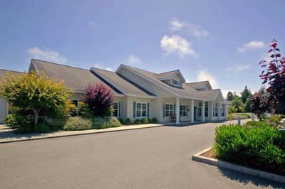 Exterior view of Addie Meedom House with landscaping