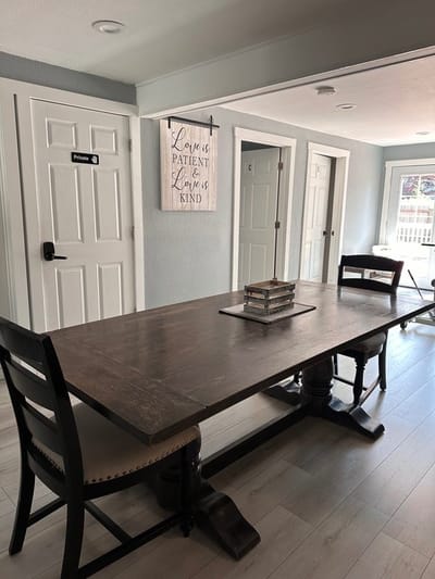 Bright interior space with a wooden table and chairs.