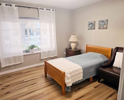 Cozy private room with a single bed and window