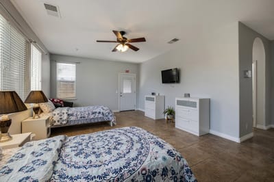 A welcoming shared resident room with two beds