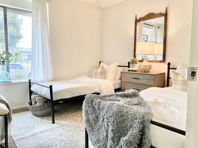 Cozy shared bedroom setup with two beds