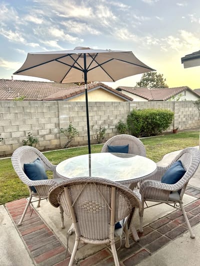 Outdoor seating area with a table and parasol