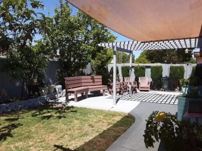 Outdoor garden area with seating and shade structures