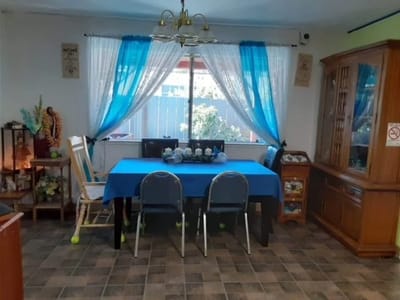 Bright dining area with blue decor and dining table