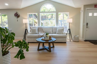 Bright interior common area with seating and plants