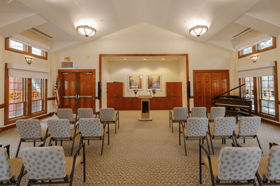 Empty activity room with chairs arranged for an event
