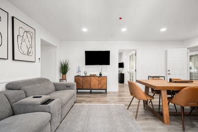 Bright interior common area with seating and dining table