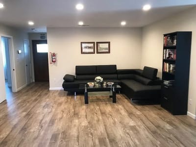 A cozy common area with seating and decor