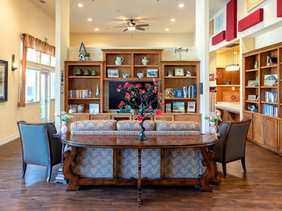 Comfortable common area with bookshelves and seating