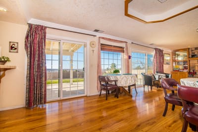 Bright common area with tables and outdoor view