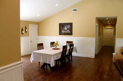 Dining area with a table and chairs in a common room