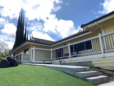 Exterior view of a senior living facility with landscaping