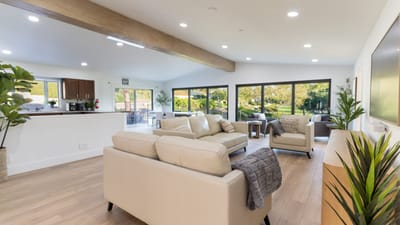 Interior view of a bright common area with plants