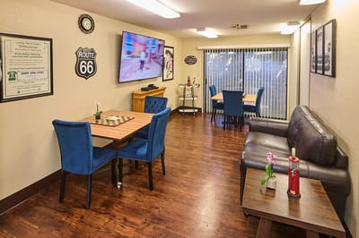 Common area with seating and tables in a cozy interior