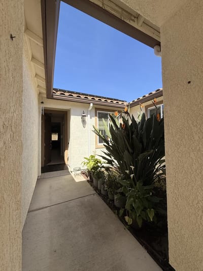 Entrance hallway leading to a courtyard.
