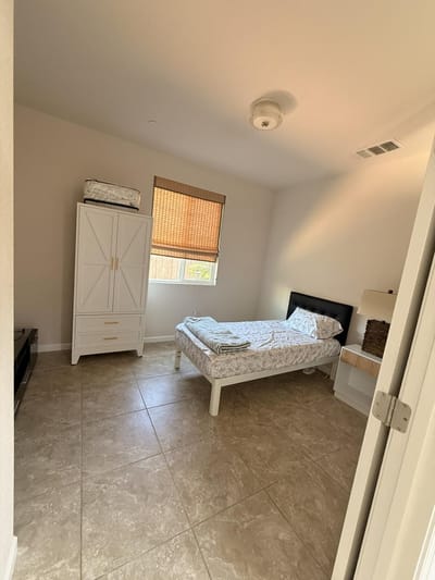 Private resident room with bed and furniture