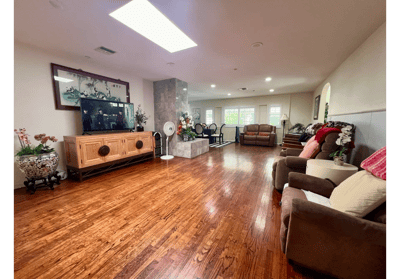 Bright common area with wooden floor and comfortable seating