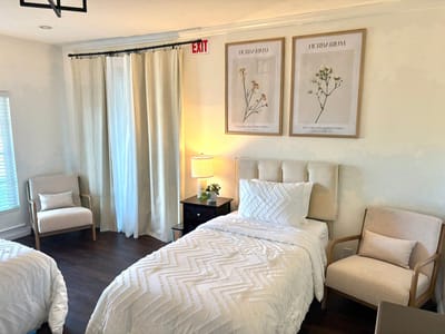 Private resident room with twin beds and decor