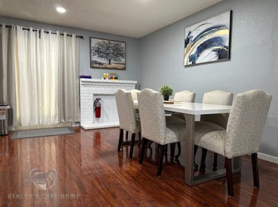 Brightly lit dining area with elegant chairs and table